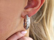 diamond hoop earring in ear