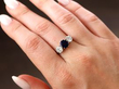 sapphire diamond trilogy ring on finger