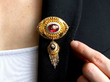 wearing garnet brooch