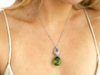 wearing peridot and diamond pendant