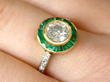 emerald diamond ring on finger
