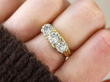 diamond trilogy ring on finger