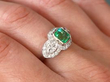 platinum Emerald and Diamond Ring on finger