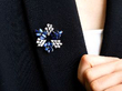wearing sapphire and diamond brooch