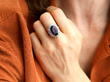 wearing amethyst and diamond ring