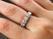 diamond white gold eternity ring on finger