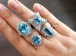 wearing blue gemstone rings
