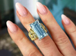 aquamarine diamond gold ring being worn