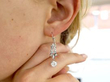 Art Deco diamond earring in ear