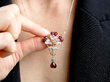 wearing garnet moonstone pendant