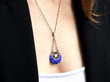 wearing enamel pearl pendant