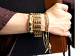gold bracelets being worn