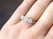 3 stone diamond ring in platinum on hand