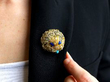 wearing lapis lazuli brooch