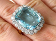 aquamarine and diamond yellow gold ring on hand