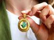 Holding Gold Brooch