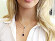 sapphire pendant being worn