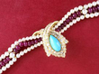pearl and ruby strand necklace with turquoise and diamond clasp