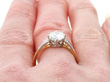 diamond and yellow gold engagement ring on finger