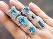 blue gemstone rings on hand
