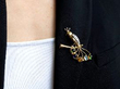 wearing gemstone bird brooch