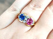 pink and blue sapphire ring on finger