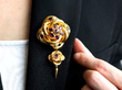 wearing garnet gold tassel brooch