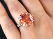 pink tourmaline and diamond white gold ring on finger