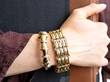wearing gold bracelets