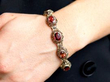 wearing garnet and citrine gold bracelet