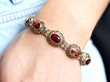 garnet and citrine gold bracelet on wrist