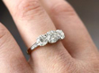diamond three stone ring on hand