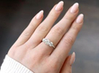 gold diamond trilogy ring on hand