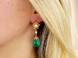 emerald drop earring in ear