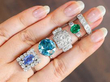 gemstone rings stacked on finger