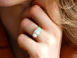 wearing Opal Trilogy Ring in Yellow Gold