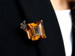 wearing citrine and diamond brooch