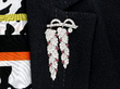 Wearing Ruby and Diamond Vine Shoot Brooch in Platinum
