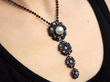 Black Diamond and Pearl Pendant on neck