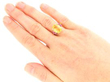 Yellow Sapphire Ring with Rubies in Gold on hand