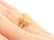 Yellow Sapphire Ring with Rubies in Gold wearing