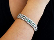 emerald diamond bracelet in platinum wearing
