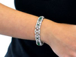 wearing emerald diamond bracelet in platinum