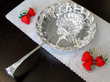 silver ladle and strawberry dish