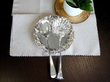 silver flatware and strawberry dish