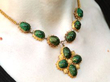 Scarab Beetle Necklace in Yellow Gold on neck