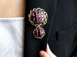 wearing garnet brooch