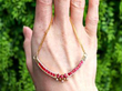 Vintage Yellow Gold and Ruby Necklace outside