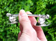 Antique Silver Duck Knife Rests outside