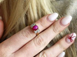 Ruby Cabochon Ring with Diamonds on finger